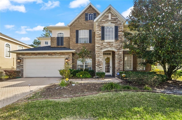 view of front of home with a garage and a front yard