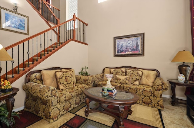 tiled living room with a high ceiling