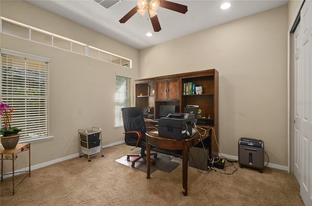 office featuring light carpet and ceiling fan