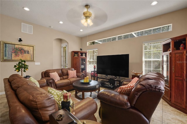 living room with light tile patterned floors and ceiling fan