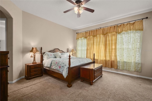 bedroom with light colored carpet and ceiling fan