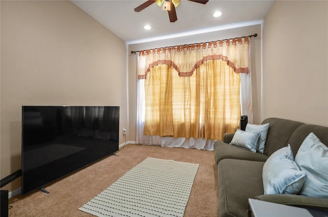 carpeted living room with vaulted ceiling and ceiling fan