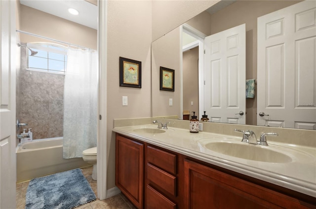 full bathroom with vanity, shower / bathtub combination with curtain, tile patterned floors, and toilet