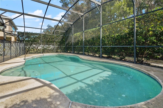 view of pool with a lanai and a patio area