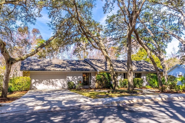 ranch-style house featuring a garage