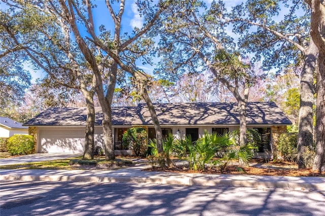 single story home with a garage