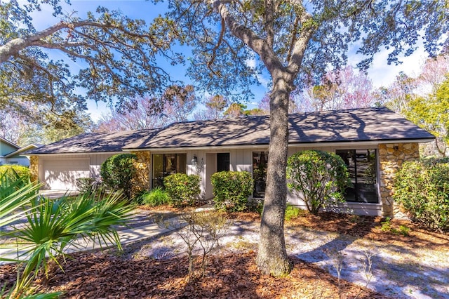 ranch-style home with a garage