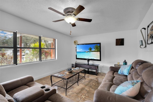 living room with lofted ceiling, a textured ceiling, and ceiling fan