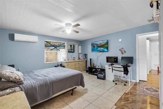 bedroom featuring a wall mounted air conditioner, a textured ceiling, and ceiling fan