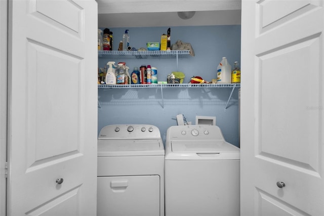 laundry room with washing machine and dryer