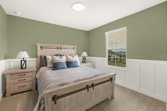 bedroom featuring light colored carpet