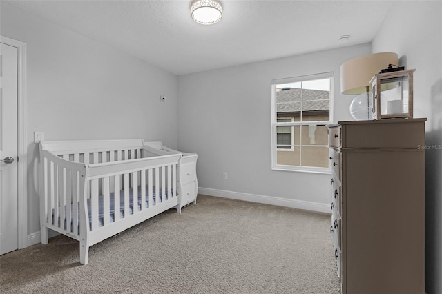 carpeted bedroom with a textured ceiling