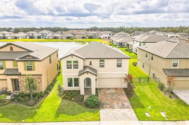 view of front of home featuring a garage and a front yard