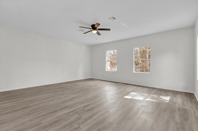 unfurnished room with ceiling fan and light hardwood / wood-style flooring