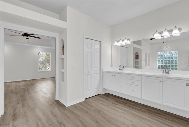 bathroom featuring vanity, hardwood / wood-style flooring, and ceiling fan