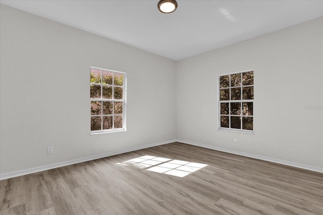 spare room featuring light wood-type flooring