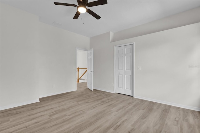 unfurnished room with ceiling fan and light hardwood / wood-style flooring