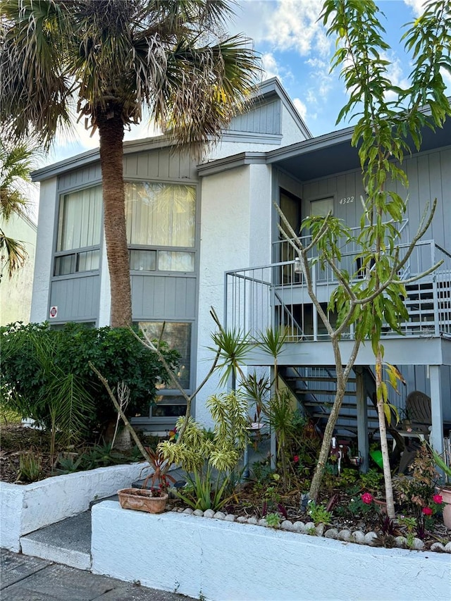 view of side of home with a balcony