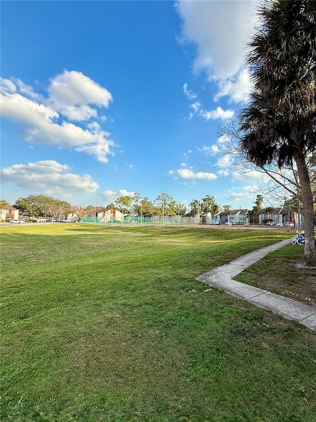 view of home's community with a lawn