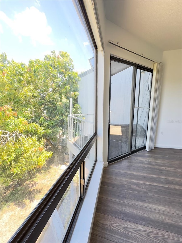 unfurnished sunroom with a healthy amount of sunlight