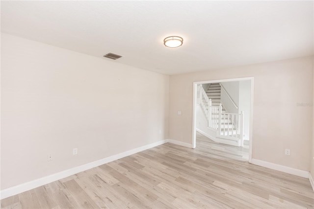 unfurnished room featuring light wood-type flooring