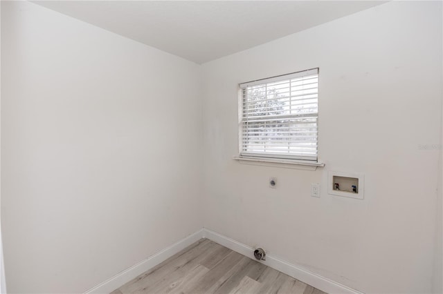 washroom with washer hookup, hookup for an electric dryer, and light wood-type flooring