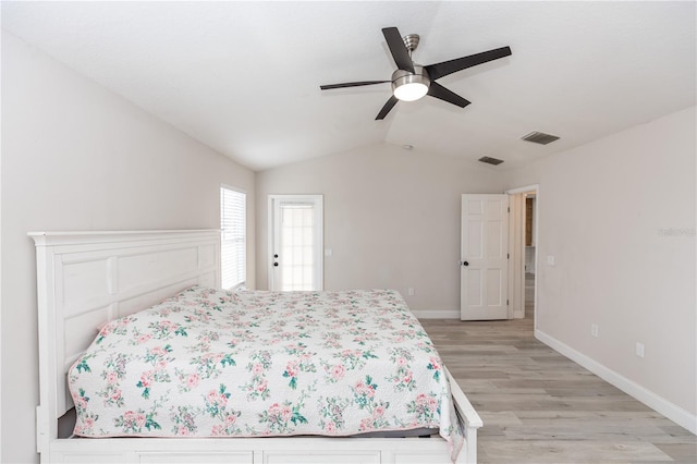 bedroom featuring ceiling fan, lofted ceiling, and light hardwood / wood-style flooring