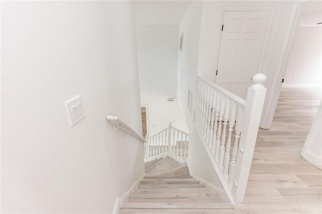 stairway with wood-type flooring