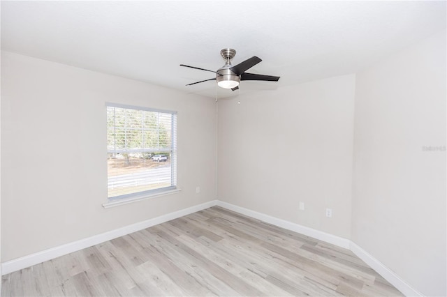 empty room with ceiling fan and light wood-type flooring