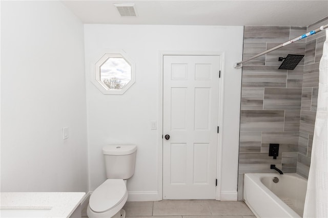 bathroom featuring tile patterned flooring, shower / bath combination with curtain, and toilet