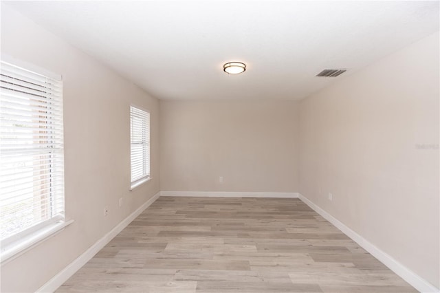 unfurnished room featuring light hardwood / wood-style flooring