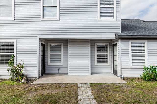 back of house with a yard and a patio area