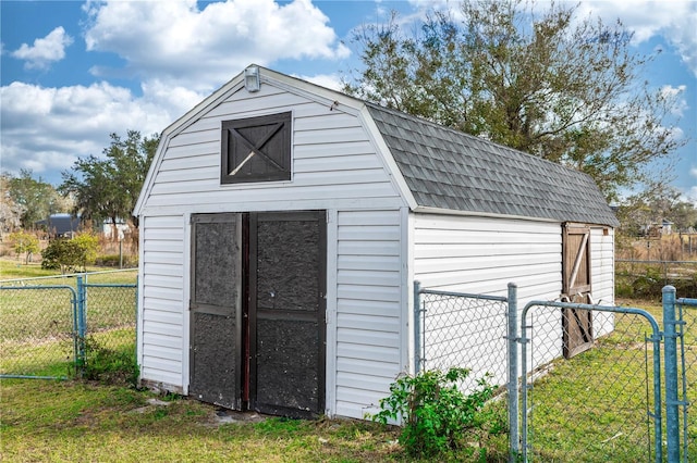 view of outdoor structure with a lawn