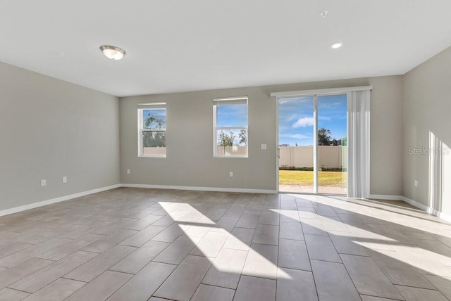 unfurnished room with a wealth of natural light