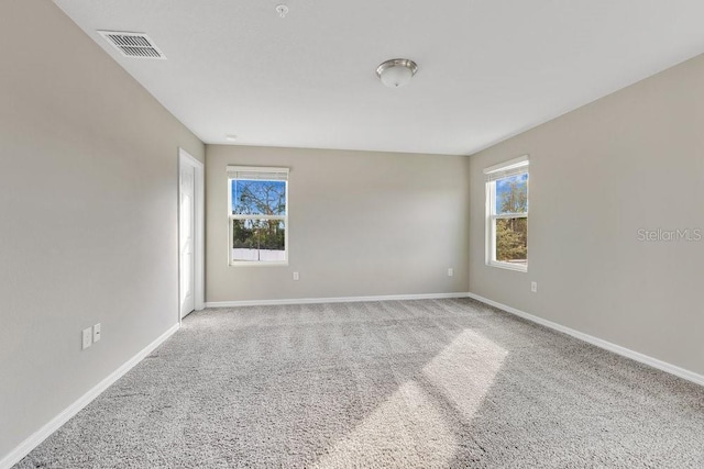 unfurnished room with carpet floors