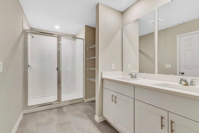 bathroom with vanity and an enclosed shower