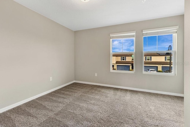 unfurnished room with carpet flooring