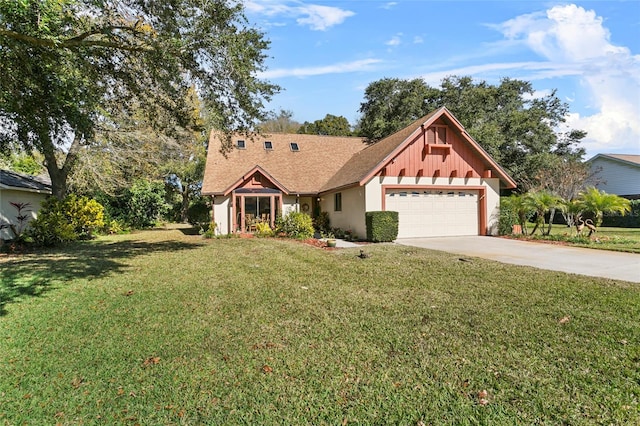 view of front of property with a garage and a front lawn