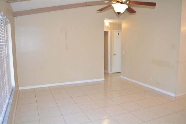 tiled spare room with ceiling fan and lofted ceiling