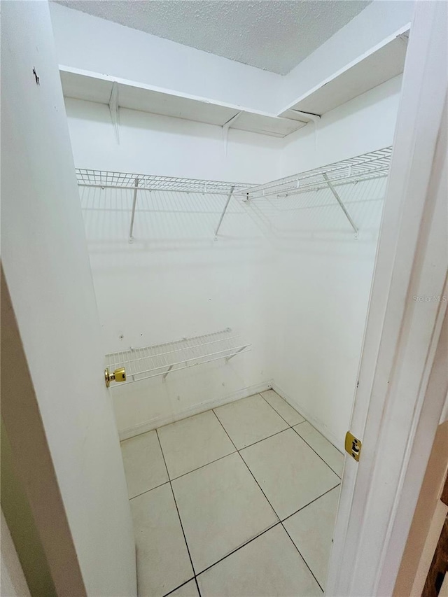 walk in closet featuring light tile patterned floors