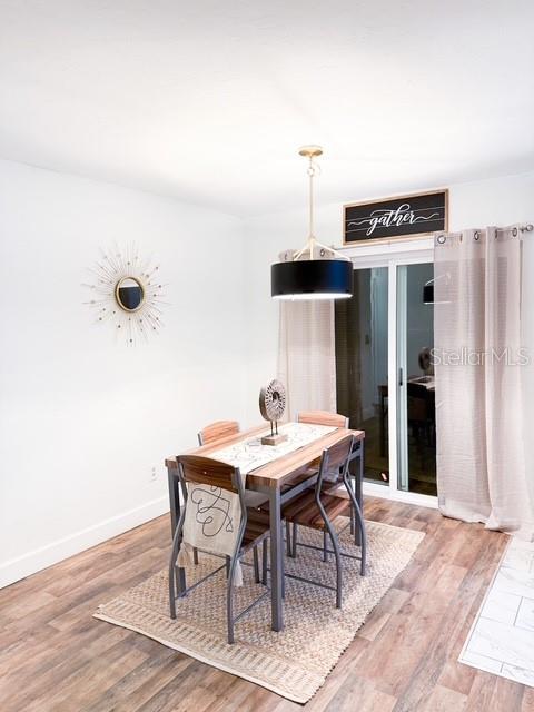 dining area featuring hardwood / wood-style floors