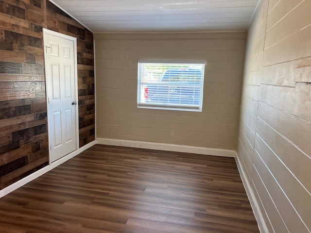 empty room featuring dark hardwood / wood-style flooring