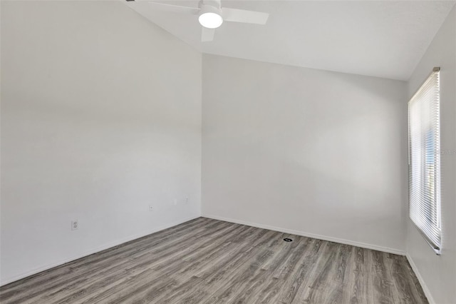 spare room with ceiling fan, lofted ceiling, and light hardwood / wood-style floors