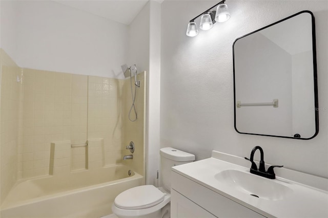 full bathroom featuring vanity, bathtub / shower combination, and toilet