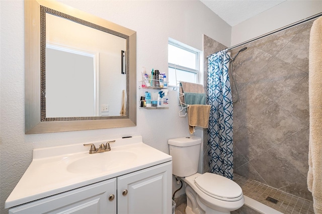 bathroom with vanity, toilet, and walk in shower