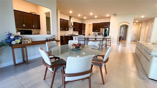 dining space featuring light tile patterned floors