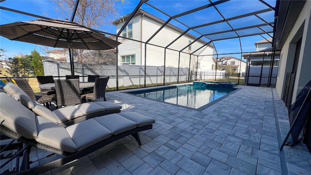 view of pool with a lanai and a patio