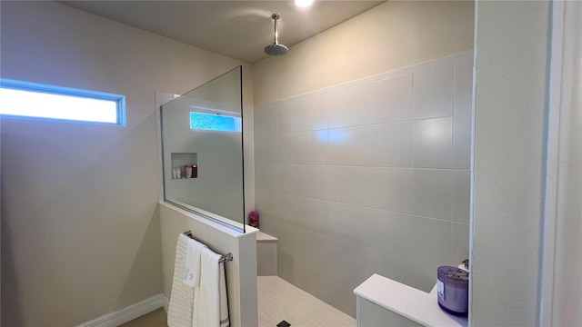 bathroom with tiled shower