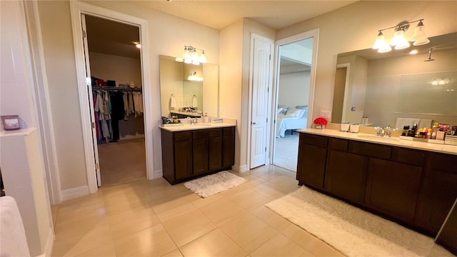 bathroom with tile patterned floors and vanity