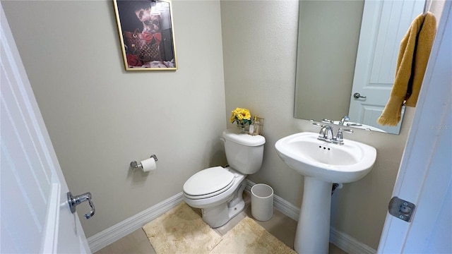 bathroom with tile patterned floors and toilet